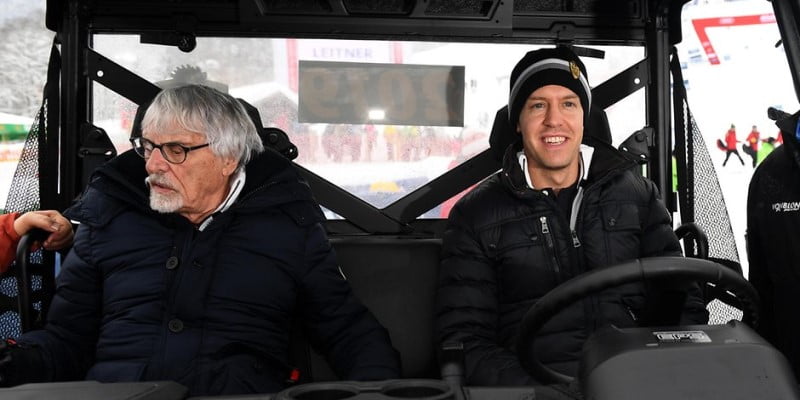 Bernie Ecclestone and Sebastian Vettel enjoy a friendly ride in a snow mobile
