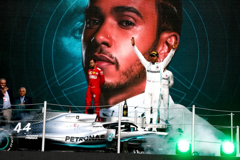 Lewis Hamilton's Mercedes is hoisted to the podium after winning the 2019 Mexico Grand Prix by beating Ferrari's Sebastian Vettel