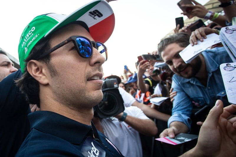 Racing Point F1 Team's Sergio Perez, one of the older generation of drivers, interacts with younger fans of the sport at his home race in Mexico.