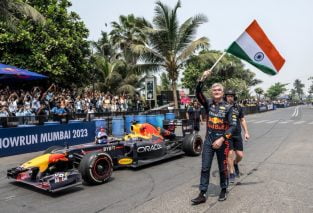 David Coulthard waives the Indian flag during his most-recent Red Bull show car run event in Mumbai, India. The show car event was broadcast in India but Formula 1 races aren't.