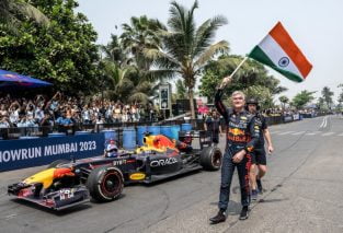 David Coulthard waives the Indian flag during his most-recent Red Bull show car run event in Mumbai, India. The show car event was broadcast in India but Formula 1 races aren't.
